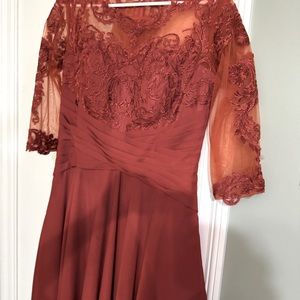 Tea length dress. Worn once. Size 14. Burnt orange color. No alterations made.